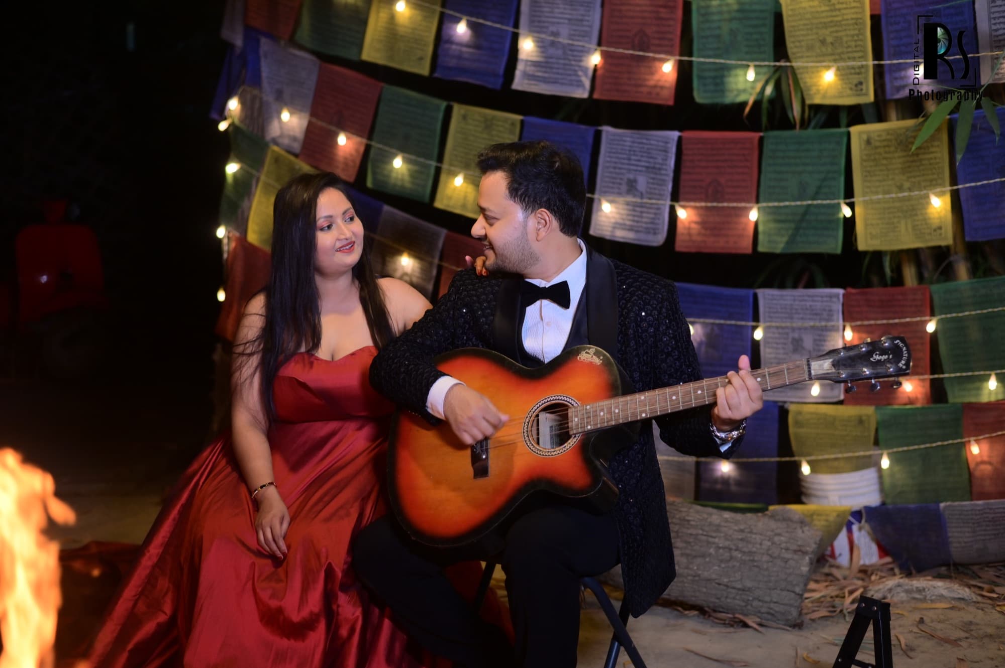 Payal & Mukul — guitar & prayer flags